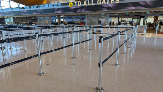 Retractable belt stanchions used for queue and crowd control in an airport